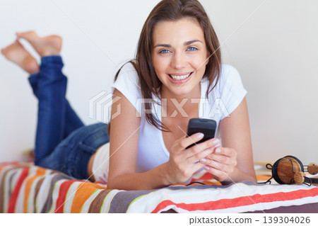Smile, bed and girl in morning with phone, checking email or social media post in home weekend. Relax, rest and communication, happy woman with smartphone and scroll in apartment, house or bedroom. Smile, bed and girl in morning with phone, checking email or social media post in home weekend. Relax, rest and communication, happy woman with smartphone and scroll in apartment, house or bedroom. 139304026