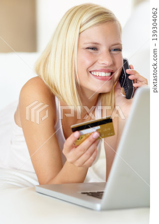 Phone call, happy and woman with laptop, credit card and online shopping payment in home. Ecommerce, crm and girl on sofa on cellphone discussion for deal, offer or internet sale in living room Phone call, happy and woman with laptop, credit card and online shopping payment in home. Ecommerce, crm and girl on sofa on cellphone discussion for deal, offer or internet sale in living room 139304062