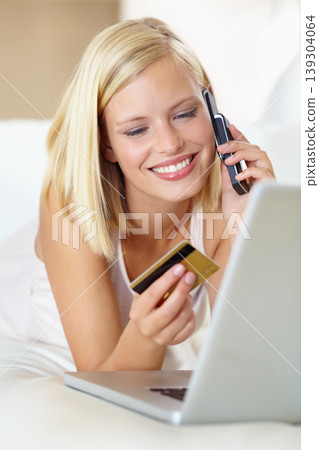 Phone call, sofa and happy woman with laptop, credit card and online shopping with payment in home. Ecommerce, crm and girl on couch with cellphone for deal, offer or internet sale in living room. Phone call, sofa and happy woman with laptop, credit card and online shopping with payment in home. Ecommerce, crm and girl on couch with cellphone for deal, offer or internet sale in living room. 139304064