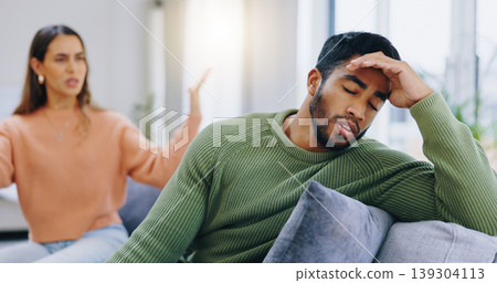 Couple, home and fight on couch, sad and angry with stress, mental health and headache with relationship crisis. Man, woman and questions on lounge sofa with conflict, anxiety and mistake in marriage Couple, home and fight on couch, sad and angry with stress, mental health and headache with relationship crisis. Man, woman and questions on lounge sofa with conflict, anxiety and mistake in marriage 139304113