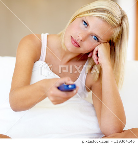 Relax, portrait and woman on sofa watching tv with remote, pillow and streaming movies in home. Controller, television and girl on couch in living room with choice of video, film or network show. 139304146
