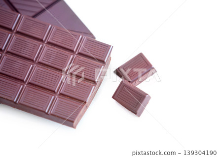 Milk chocolate, studio candy and cacao sweets for delicious swiss bar, wellness and dark cocoa grid slab, tasty dessert or snack. Junk food, sugar treat and luxury premium product on white background Milk chocolate, studio candy and cacao sweets for delicious swiss bar, wellness and dark cocoa grid slab, tasty dessert or snack. Junk food, sugar treat and luxury premium product on white background 139304190