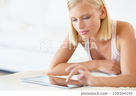 Relax, tablet and woman on bed for social media, online shopping and internet in bedroom. Chat, resting and person on digital tech for reading website, news blog and research on weekend at home Relax, tablet and woman on bed for social media, online shopping and internet in bedroom. Chat, resting and person on digital tech for reading website, news blog and research on weekend at home 139304195