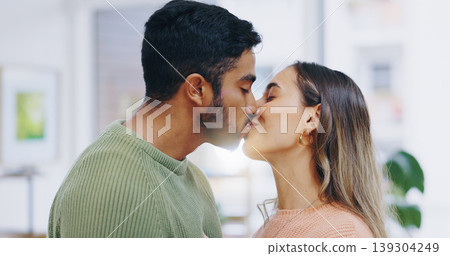 Love, kiss and couple in a house with care, trust or security, bond or happy relationship moment. Passion, date or people in a living room with respect, gratitude or soulmate connection at home Love, kiss and couple in a house with care, trust or security, bond or happy relationship moment. Passion, date or people in a living room with respect, gratitude or soulmate connection at home 139304249