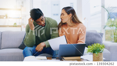 Couple, debt and stress at laptop in home for poor savings, bills and budget of mortgage crisis, taxes or rent. Frustrated man, woman and banking documents for bankruptcy, financial risk or inflation Couple, debt and stress at laptop in home for poor savings, bills and budget of mortgage crisis, taxes or rent. Frustrated man, woman and banking documents for bankruptcy, financial risk or inflation 139304262