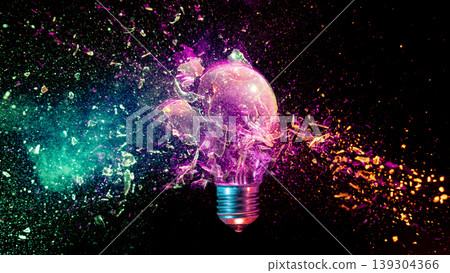 Lightbulb exploding into colorful particles black background Lightbulb exploding into colorful particles black background 139304366