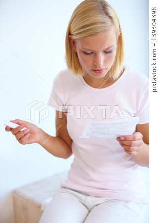Reading, instructions and woman with pregnancy test in bathroom waiting for results, news and information. Motherhood, pregnant and person with medical testing kit for fertility or ovulation at home Reading, instructions and woman with pregnancy test in bathroom waiting for results, news and information. Motherhood, pregnant and person with medical testing kit for fertility or ovulation at home 139304398