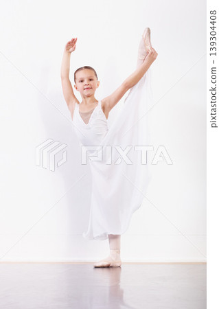 Portrait, stretching and girl in ballet studio with pose, balance and modern dance class. Performance, talent and young ballerina dancer with pride, confidence and creative child at learning academy. Portrait, stretching and girl in ballet studio with pose, balance and modern dance class. Performance, talent and young ballerina dancer with pride, confidence and creative child at learning academy. 139304408