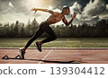 Man, runner and starting line for sprint, cardio and ready for marathon, track and race or competition. Black male person, training and exercising or speed, practice and athlete or fitness for body 139304412