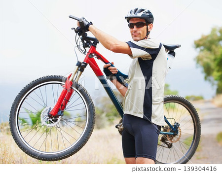 Portrait, bicycle and fitness with a man in the mountains for cardio training, recreation or summer hobby. Sports, cycling and freedom with a confident young athlete outdoor for eco friendly exercise 139304416