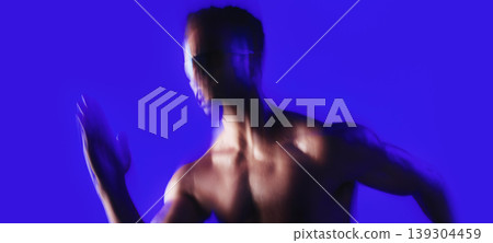 Fitness, motion blur or man in studio with sprint, cardio or stamina exercise in speed activity. Fast, intense run or person with movement, sports hobby or endurance workout on blue background. Fitness, motion blur or man in studio with sprint, cardio or stamina exercise in speed activity. Fast, intense run or person with movement, sports hobby or endurance workout on blue background. 139304459