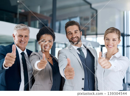 Portrait, thumbs up or team of business people in agreement, support or collaboration together in office. Proud community, group or happy employees smile with diversity, yes sign or like hand gesture Portrait, thumbs up or team of business people in agreement, support or collaboration together in office. Proud community, group or happy employees smile with diversity, yes sign or like hand gesture 139304544