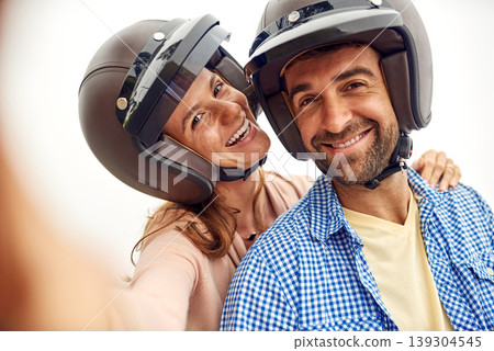 Couple, helmet and selfie on adventure, smile and road trip or holiday, romance and memories. Happy people, freedom and outdoors or travel, laughing and love for social media, portrait and vacation Couple, helmet and selfie on adventure, smile and road trip or holiday, romance and memories. Happy people, freedom and outdoors or travel, laughing and love for social media, portrait and vacation 139304545