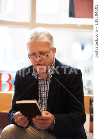 Reading, books and mature man in library for literature, information and knowledge in bookstore. Bookshelf, shopping and senior person with choice, decision and option for story, novel and learning 139304603