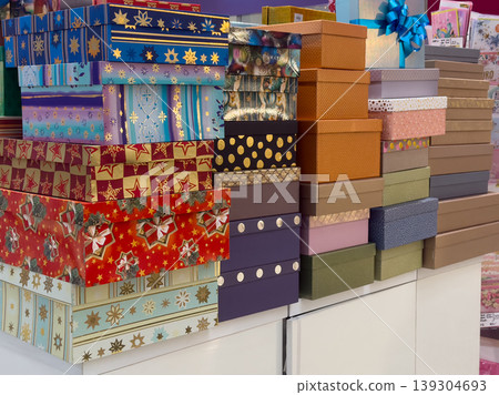 Assortment of decorative gift boxes stacked in various sizes and colorful patterns, ready for packaging presents and celebrations 139304693