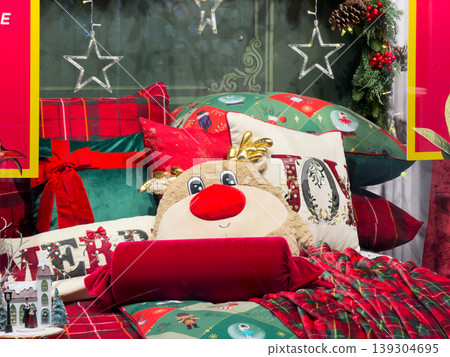 Cozy Christmas bedding ensemble featuring plush reindeer, festive pillows with JOY and MERRY text, plaid blankets, and starry decor Cozy Christmas bedding ensemble featuring plush reindeer, festive pillows with JOY and MERRY text, plaid blankets, and starry decor 139304695