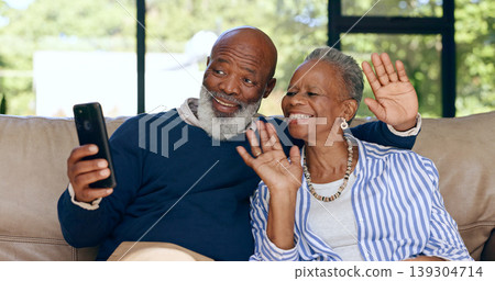 Happy senior couple, video call and smartphone in home for voip communication, social network or chat. African man, woman and wave hello for virtual conversation, mobile contact or talk in retirement 139304714