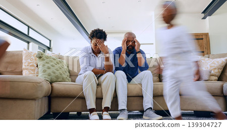 Running child, tired parents and headache on a sofa with stress, anxiety or fatigue at home. Family, chaos and frustrated people in a living room with hyper kid, burnout or overwhelmed by adhd energy 139304727