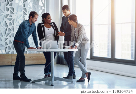 Collaboration, laptop and business people in the office together for a meeting to discuss strategy. Computer, planning or teamwork with an employee group of men and women in a workplace for research 139304734