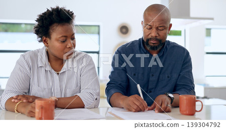 Couple, married and signature with document in home for paperwork, contract or legal agreement. Black woman, man and worry for future, finances and savings by cover in safety in security for divorce Couple, married and signature with document in home for paperwork, contract or legal agreement. Black woman, man and worry for future, finances and savings by cover in safety in security for divorce 139304792