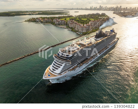 Large cruise liner departing from Miami port. Travel to Florida vacation concept. Large cruise liner departing from Miami port. Travel to Florida vacation concept. 139304822
