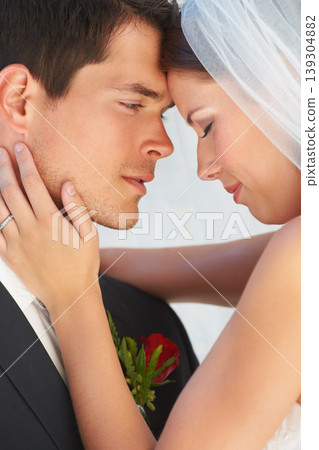 Face, bride and groom embrace at wedding with smile, love and commitment for couple at reception. Romance, woman and man hugging at marriage celebration with happiness, loyalty and future together. 139304882
