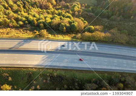 Highway road in American rural area. Expressway lanes for fast passing of car traffic Highway road in American rural area. Expressway lanes for fast passing of car traffic 139304907