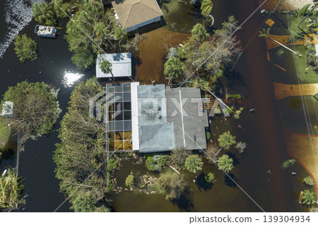 Heavy flood with high water surrounding residential houses after hurricane Ian rainfall in Florida residential area. Consequences of natural disaster Heavy flood with high water surrounding residential houses after hurricane Ian rainfall in Florida residential area. Consequences of natural disaster 139304934