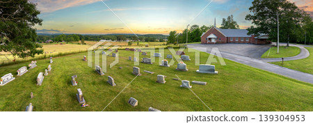 Grave tombstones at old cemetery in small town America. Death concept Grave tombstones at old cemetery in small town America. Death concept 139304953