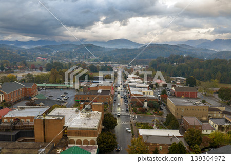 Franklin main street lined with illuminated restaurants, souvenir stores, and mountain lodges. North Carolina travel destination at night. Franklin main street lined with illuminated restaurants, souvenir stores, and mountain lodges. North Carolina travel destination at night. 139304972
