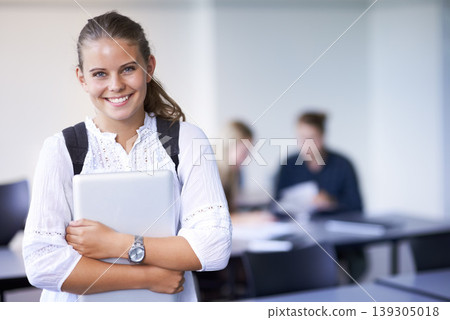 Girl, portrait and teenager with laptop in classroom, back to school and excited for learning. Academy, student and happy face with computer or tech for education, study and kid with a scholarship 139305018