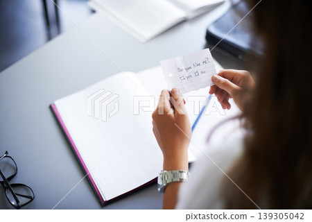 Secret, note and student with love letter in class at high school with girl and social communication. Hand, paper and teenager with checklist, information or romantic question in classroom from crush Secret, note and student with love letter in class at high school with girl and social communication. Hand, paper and teenager with checklist, information or romantic question in classroom from crush 139305042