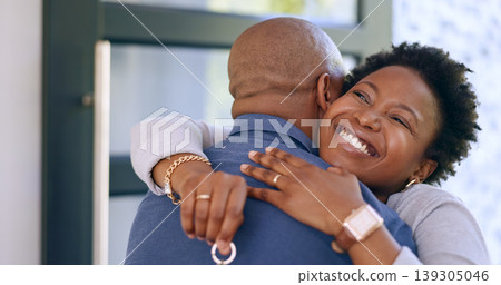 Couple, hug and key in new home or happy for real estate, property investment or celebration by front door. Black people, man and woman with embrace for fresh start, achievement and mortgage or smile Couple, hug and key in new home or happy for real estate, property investment or celebration by front door. Black people, man and woman with embrace for fresh start, achievement and mortgage or smile 139305046