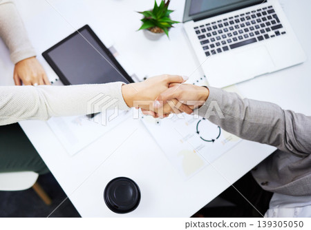 Client meeting, top view people and hand shake for negotiation success, B2B deal or company acquisition. Business, welcome introduction and partner agreement, cooperation and handshake for promotion Client meeting, top view people and hand shake for negotiation success, B2B deal or company acquisition. Business, welcome introduction and partner agreement, cooperation and handshake for promotion 139305050