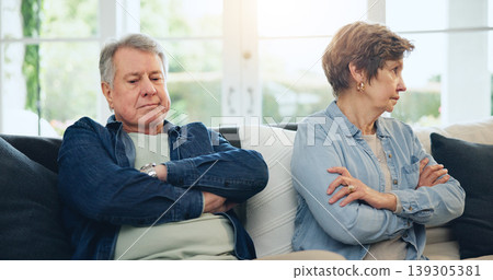 Senior, couple and stress with divorce and fight on sofa in living room of home with anger and silence. Elderly, man or woman with argument, upset and frustrated on couch in lounge of house or ignore Senior, couple and stress with divorce and fight on sofa in living room of home with anger and silence. Elderly, man or woman with argument, upset and frustrated on couch in lounge of house or ignore 139305381