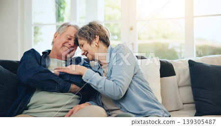 Love, home and mature couple laughing at funny conversation, retirement joke and smile on living room sofa. Wellness, comedy humour and relax old man, senior woman and elderly marriage people bonding Love, home and mature couple laughing at funny conversation, retirement joke and smile on living room sofa. Wellness, comedy humour and relax old man, senior woman and elderly marriage people bonding 139305487