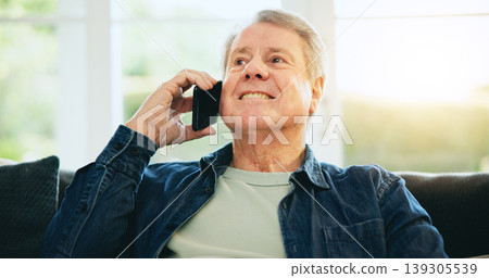 Senior man, happy or phone call in home talking or speaking in living room for communication. Smile, mobile or elderly male person in conversation to relax on lounge couch or sofa in house alone Senior man, happy or phone call in home talking or speaking in living room for communication. Smile, mobile or elderly male person in conversation to relax on lounge couch or sofa in house alone 139305539