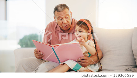 Grandpa, child and reading book on sofa for literature, education or bonding together at home. Grandparent with little girl or kid smile for story, learning or relax on living room couch at house Grandpa, child and reading book on sofa for literature, education or bonding together at home. Grandparent with little girl or kid smile for story, learning or relax on living room couch at house 139305589