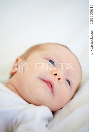 Closeup, baby and face for wake up on bed from good dream, sleep or nap in nursery. Infant, looking and relaxing on pillow for child growth, cognitive and development in hope for milestone of future Closeup, baby and face for wake up on bed from good dream, sleep or nap in nursery. Infant, looking and relaxing on pillow for child growth, cognitive and development in hope for milestone of future 139305615