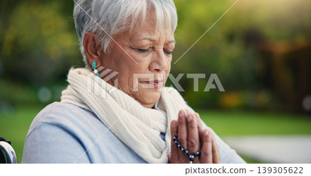 Senior woman, praying hands or rosary in wheelchair in nature, faith or hope in retirement. Mature person, catholic or meditation or praise to god, garden or petition as intercessor for jesus christ Senior woman, praying hands or rosary in wheelchair in nature, faith or hope in retirement. Mature person, catholic or meditation or praise to god, garden or petition as intercessor for jesus christ 139305622