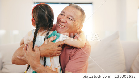 Grandfather, child and hug on sofa in living room for love, care or bond with lens flare. Elderly man, happiness and smile for little girl for moment, memories and support while babysitting at home 139305655