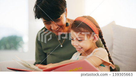 Grandparent, kid and reading book with smile, home and child development, grandchild and couch. Woman, lounge or bonding together for relationship, family and retired with girl, house and happy Grandparent, kid and reading book with smile, home and child development, grandchild and couch. Woman, lounge or bonding together for relationship, family and retired with girl, house and happy 139305663