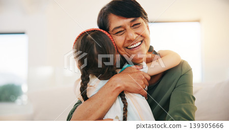 Child, grandmother and hug for happy smile bonding, relax connection in retirement. Young girl, old woman and embrace for holiday rest or together in lounge for funny joke, love trust or care safety Child, grandmother and hug for happy smile bonding, relax connection in retirement. Young girl, old woman and embrace for holiday rest or together in lounge for funny joke, love trust or care safety 139305666