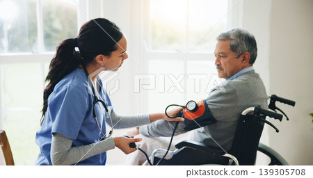 Man, caregiver and senior in wheelchair for blood pressure, monitoring or elderly care at old age home. doctor or medical nurse checking BPM of mature patient or person with a disability at house Man, caregiver and senior in wheelchair for blood pressure, monitoring or elderly care at old age home. doctor or medical nurse checking BPM of mature patient or person with a disability at house 139305708
