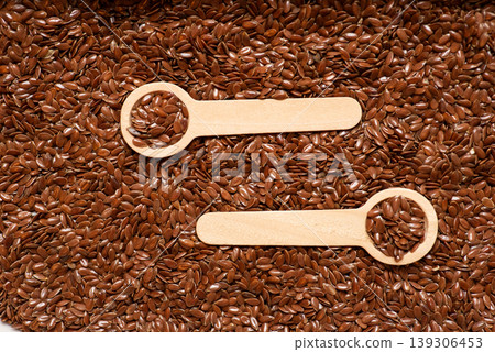 Wooden Measuring Spoons on Flax Seeds Background Wooden Measuring Spoons on Flax Seeds Background 139306453