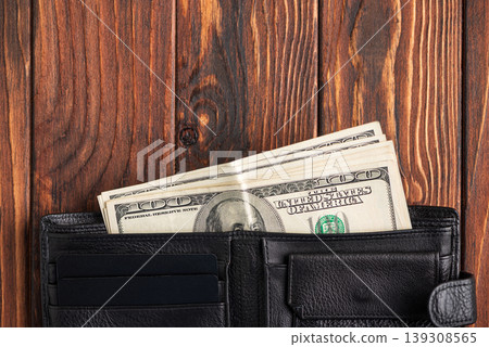 Leather Wallet with Cards, U.S. Dollar Cash on Dark Wooden Background Leather Wallet with Cards, U.S. Dollar Cash on Dark Wooden Background 139308565