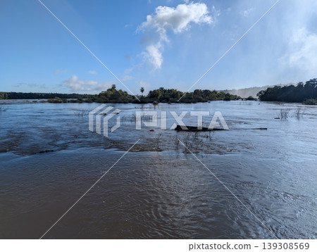 A view of the Iguazu River rapids and vegetated islands in the water at Iguazu National Park and Reserve in Argentina in June 139308569