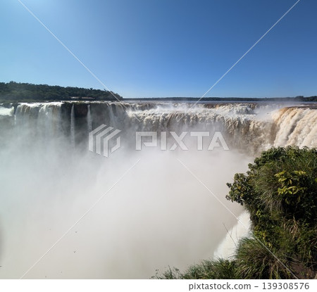 The turbulent waters of Iguazu Falls in Iguazu National Park and Reserve, Argentina, in June The turbulent waters of Iguazu Falls in Iguazu National Park and Reserve, Argentina, in June 139308576