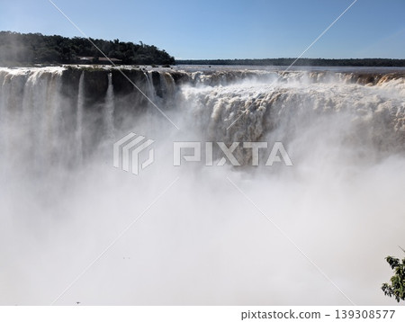The turbulent waters of Iguazu Falls in Iguazu National Park and Reserve, Argentina, in June. Close-up The turbulent waters of Iguazu Falls in Iguazu National Park and Reserve, Argentina, in June. Close-up 139308577