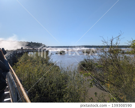 Iguazu, Argentina - June 24, 2025: Tourists in Argentina's Iguazu National Park enjoy the natural views. 139308590